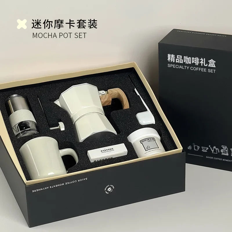 White Mocha pot set in a gift box with a black box labeled 'SPECIALTY COFFEE SET' in the background.