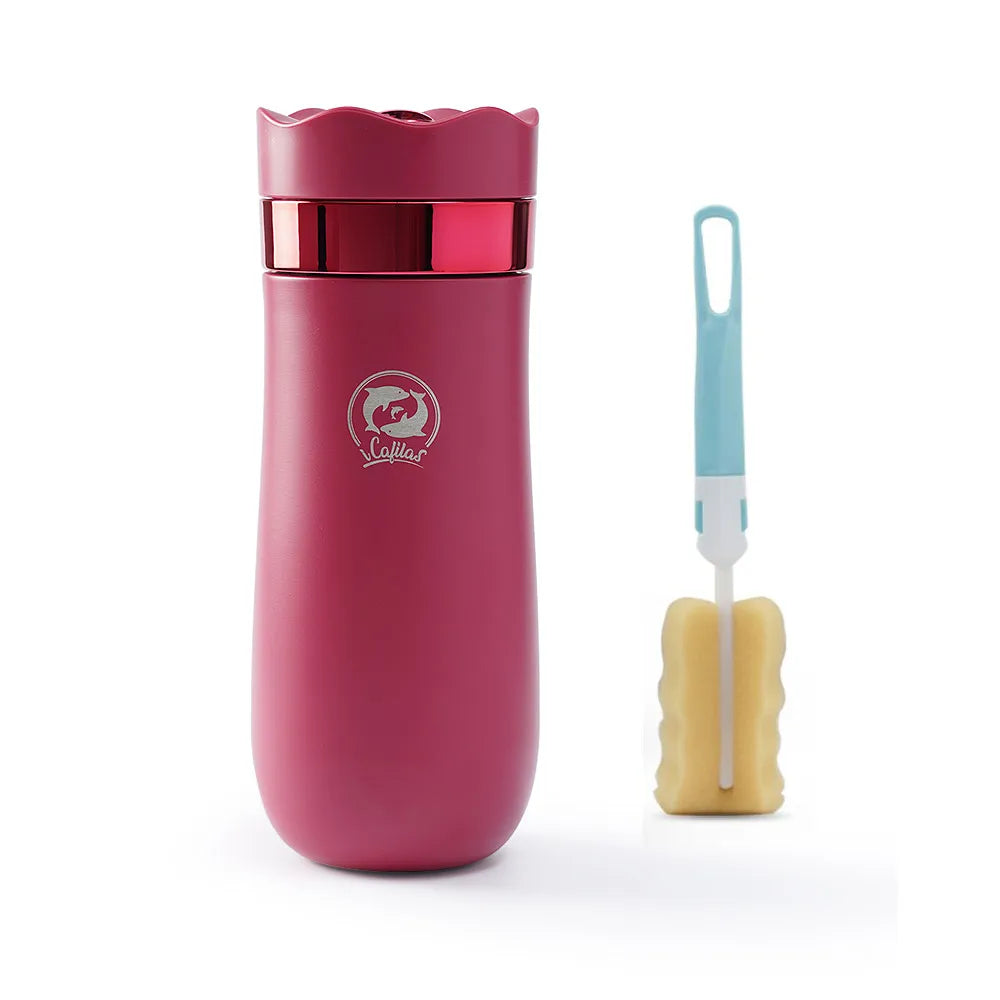 fuscia/red metal travel french press with a cleaning brush on a white background