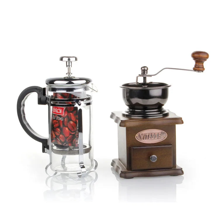 French press and manual coffee grinder on a white background