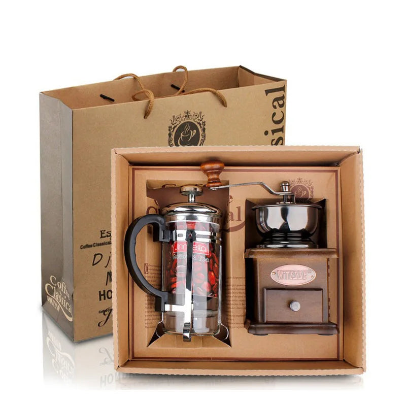Coffee-making set with a French press and grinder in a gift box, branded 'Cafelat'.