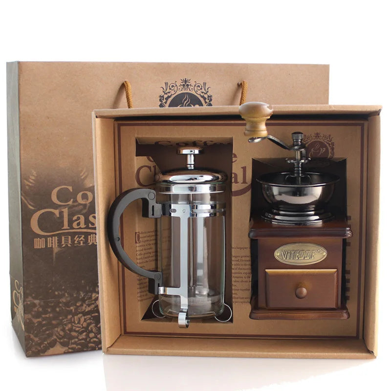 Coffee-making set with French press and grinder in a decorative box.