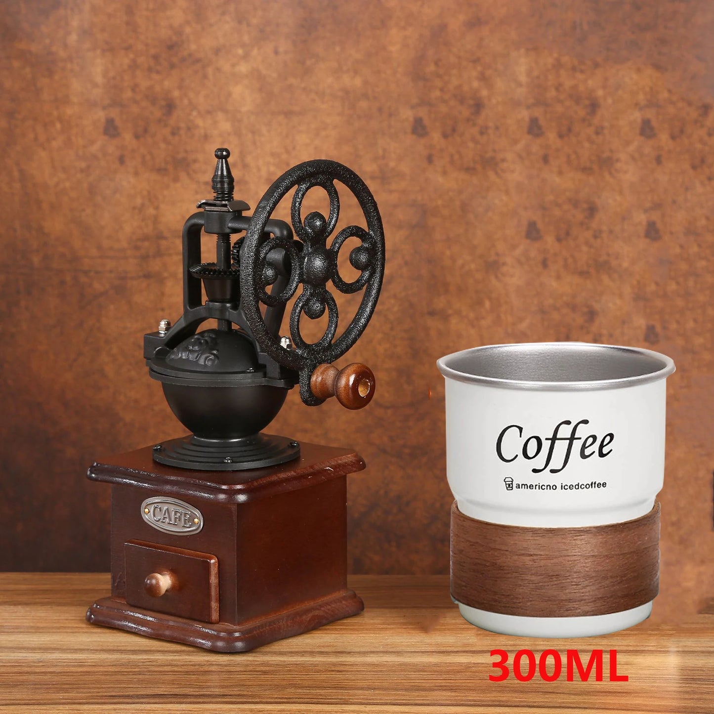 Vintage-style coffee grinder and a 'Coffee' branded cup on a wooden surface with a brown background.