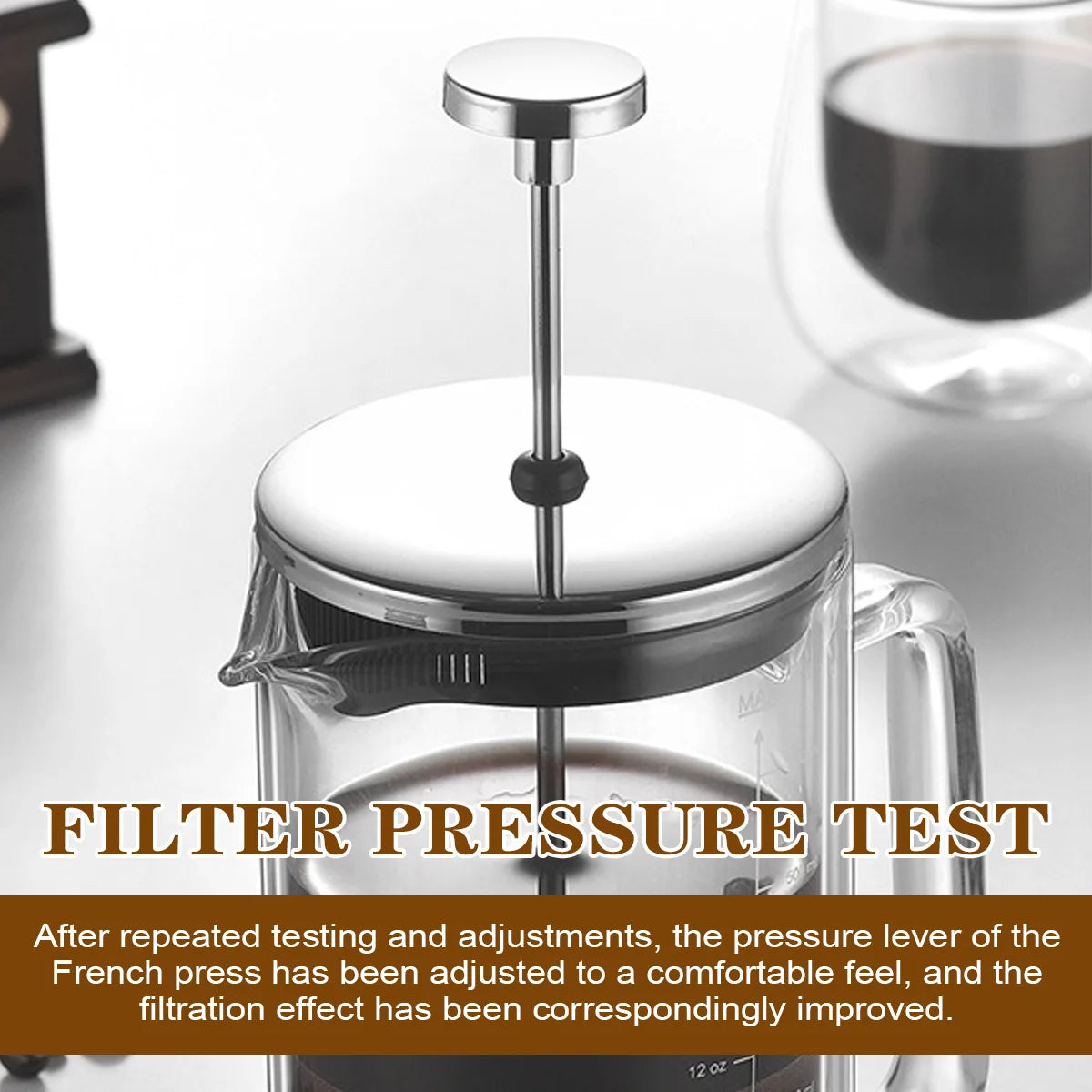 A clear glass French press with a silver metal plunger and lid is shown on a light gray surface, with a blurred glass of dark coffee in the background. Large text at the bottom reads 'FILTER PRESSURE TEST' with a descriptive paragraph below.