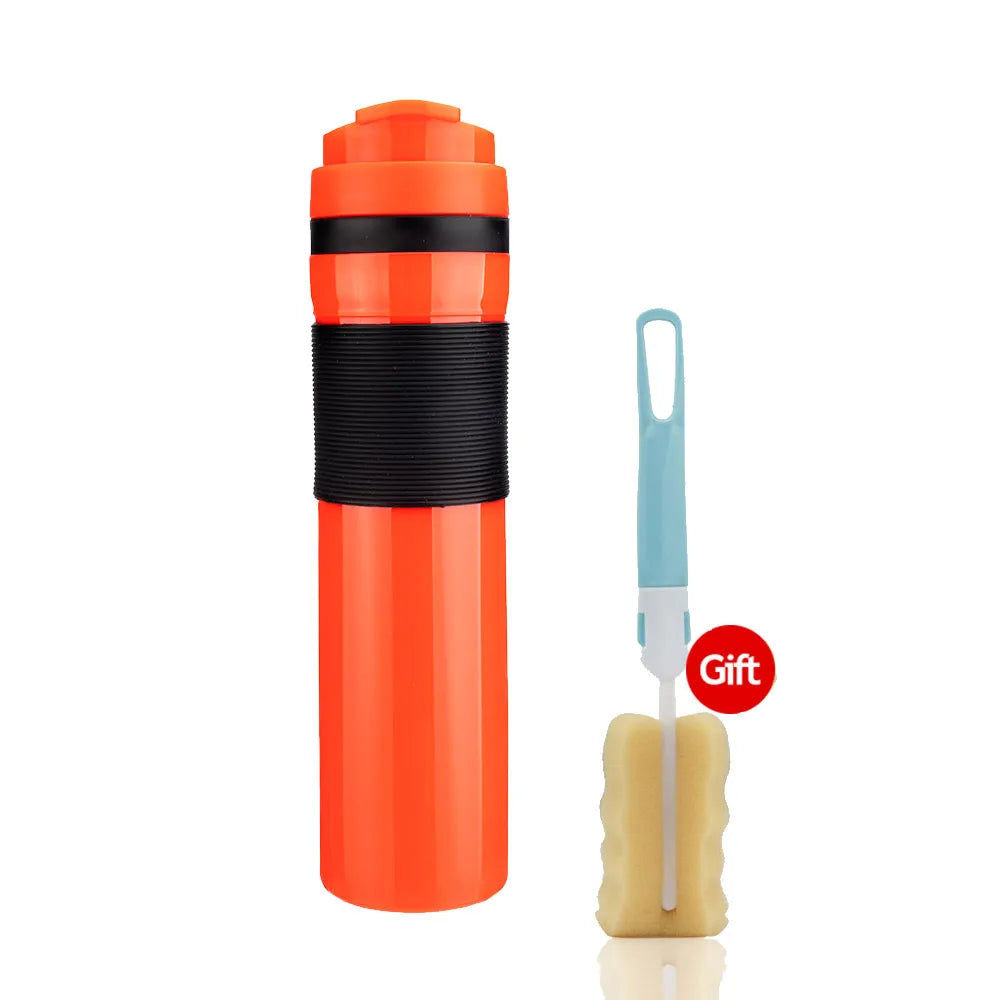 Orange plastic travel french press bottle with black band and blue tool with beige attachment on a white background