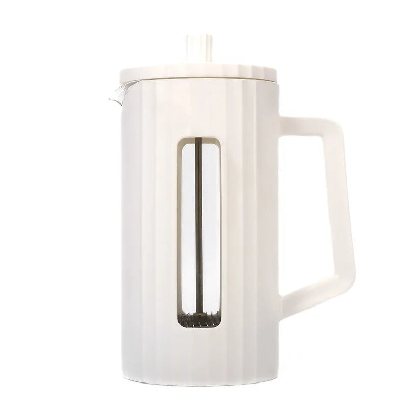 White ceramic teapot with a handle on a white background