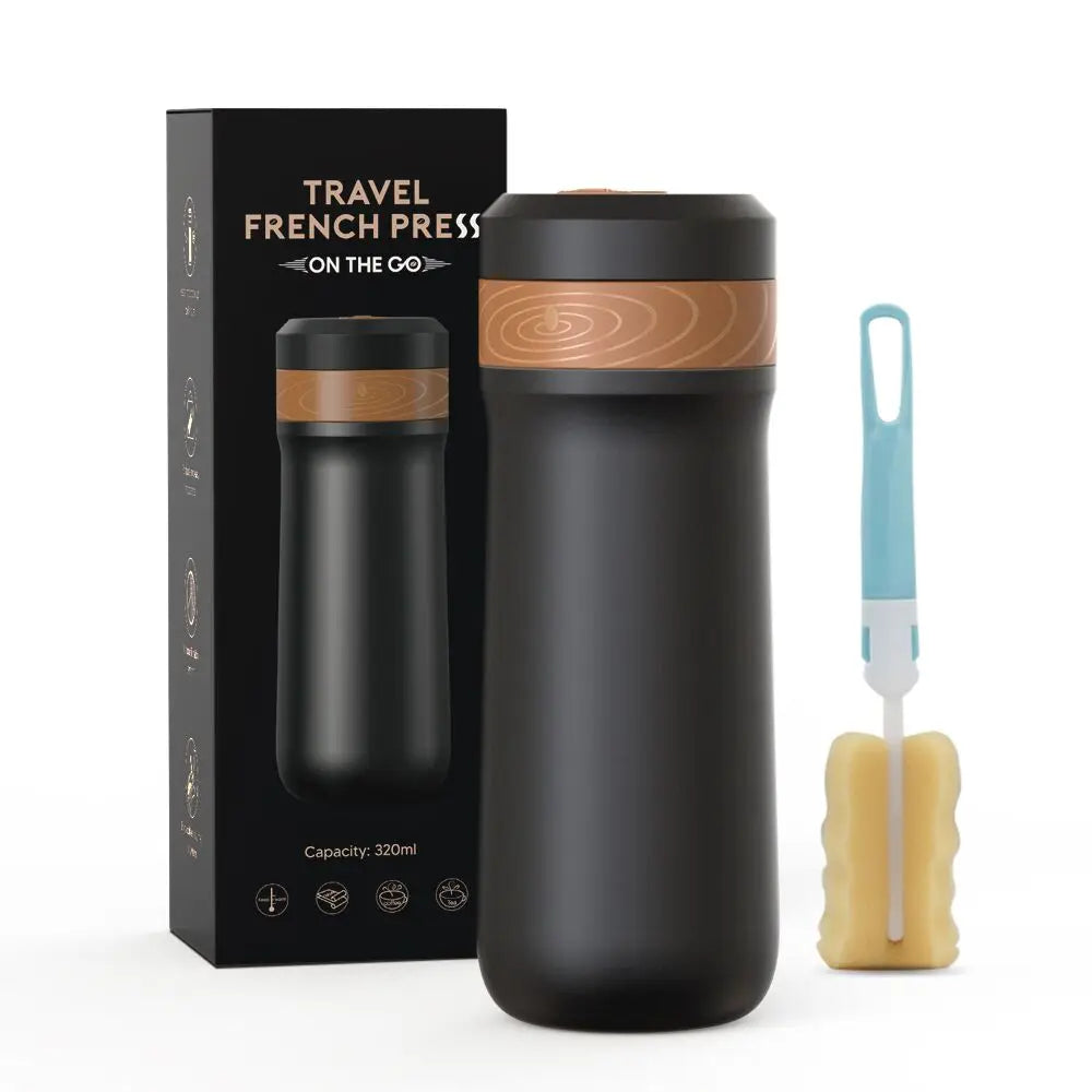 Black travel French press with wooden accents, packaging, cleaning brush, and sponge on a white background
