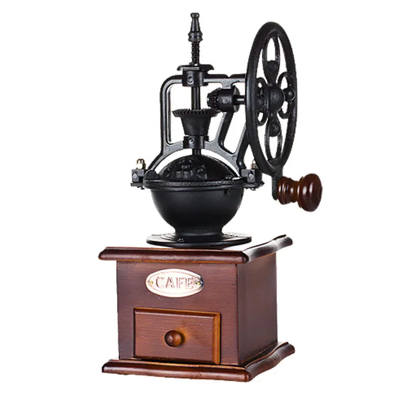 Right side and front view set at angle of vintage manual coffee grinder showing cast-iron wheel mechanism and wooden base on white background